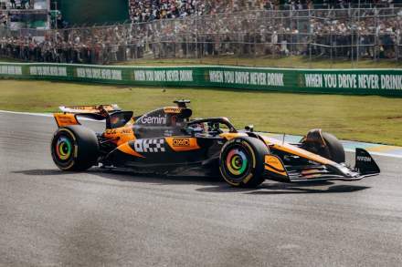 High-speed F1 car racing at Interlagos Circuit during the Brazilian Grand Prix in São Paulo.