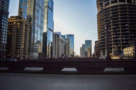 Stunning view of Chicago's modern skyline from a city bridge, featuring iconic skyscrapers.