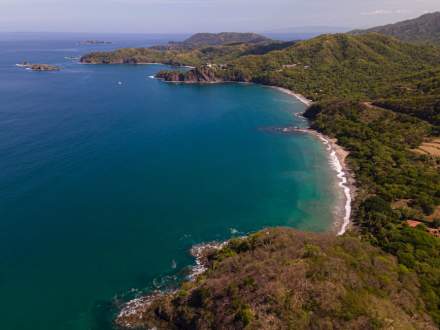 A breathtaking aerial view of the lush coastline and blue waters in Guanacaste, Costa Rica.